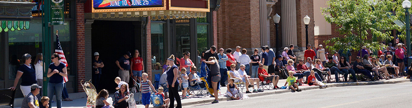 People gathered on the sidewalk