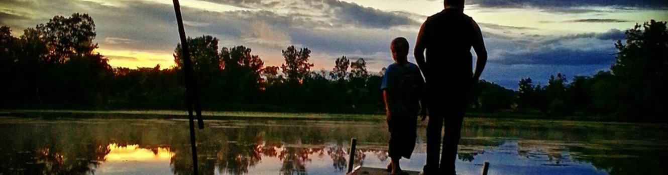 Boy and uncle at lake