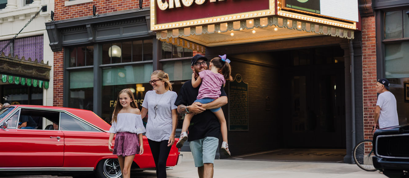 Family walking out of a theater