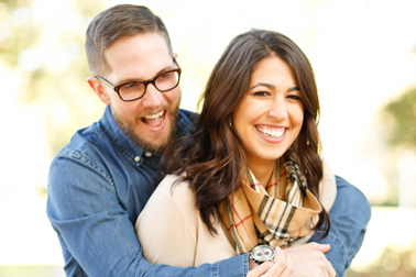 A man and woman smiling
